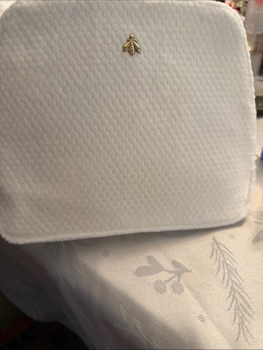 GUERLAIN White Textured Cosmetic Pouch with Gold Bee Emblem